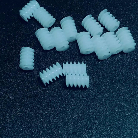 10 Pack 0.3 Module Plastic Mini Worm Gears Kit, 0.65mm Inner Hole, 3.5 by 5mm Size, white gears on black surface
