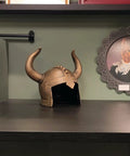 Kids Viking Horned Helmet For Costume Play LARP And Halloween displayed on a shelf, bronze finish, kid-size PVC material.