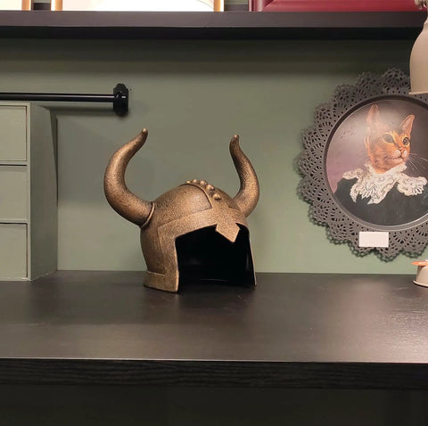 Kids Viking Horned Helmet For Costume Play LARP And Halloween displayed on a shelf, bronze finish, kid-size PVC material.
