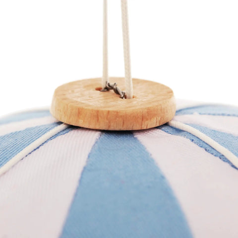 Close-up of Handmade Hanging Hot Air Balloon Nursery Decor In Baby Blue For Kids Room showing wooden top and cords.