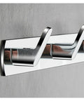 Heavy Duty Chrome Wall Hook Handles Daily Hustle In Bathrooms And Kitchens While Snagging Towels Keys And Coats To Stay Put On Tile Or Drywall Locks Down Solid With Zero Rust After Quick Install, displaying three sturdy hooks on a gray wall.
