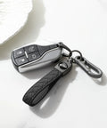 Heavy Duty Leather Carabiner Keychain With 360 Degree Rotating Snap Swivel Anti Lost D Ring And Woven Handmade Strap Microfiber Hand Strap Built For Everyday Carry Boss Level Durability For Men And Women Gunmetal Black shown with car key