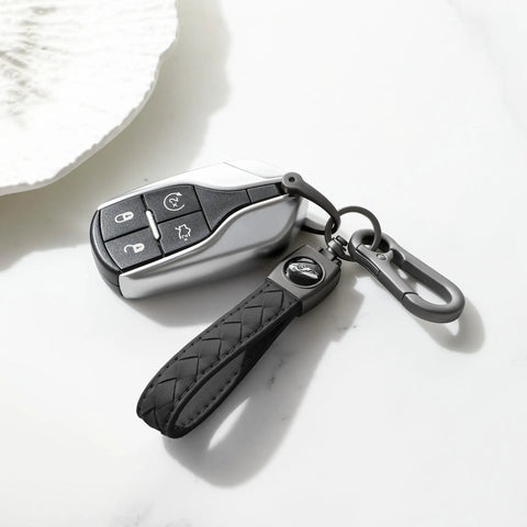 Heavy Duty Leather Carabiner Keychain With 360 Degree Rotating Snap Swivel Anti Lost D Ring And Woven Handmade Strap Microfiber Hand Strap Built For Everyday Carry Boss Level Durability For Men And Women Gunmetal Black shown with car key