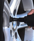 Master Impact Socket Set for Three Eighths Inch and One Half Inch Drives in use on car wheel lug nut