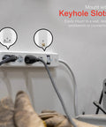No Fuss Rock Solid Surge Protector Power Strip With Ten Foot Extension Cord, shown mounted with keyhole slots.