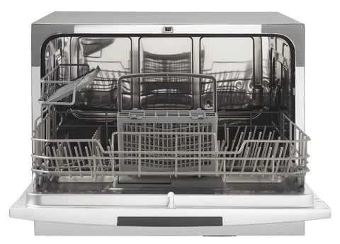 Interior view of Total Game Changer Compact Countertop Dishwasher In Brushed Stainless Steel with space for six place settings.