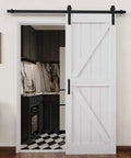 Sliding Barn Door 30 Inch By 84 Inch With 6 Foot Hardware Kit And Handle White Solid MDF Surface That Is Water Resistant And Scratch Resistant Easy To Clean And Install DIY Assembly K Frame Farmhouse Style Reno Ready installed in a kitchen doorway.