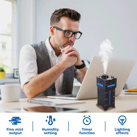 Man using DIY Humidifier Soldering Kit With Time And Humidity Settings OLED Display And LED Light Modes on desk