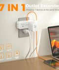 Compact 7 In 1 Wall Outlet Extender Converts One Socket To Four AC Outlets And Three USB Charging Ports Making Your Home Desk A Hella Smooth Charging Setup With Zero Sweat Ever Needed, mounted on a wall.