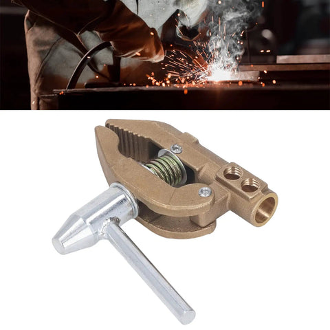 Brass Grounding Welding Clamp With Rubber Sleeve, 800A Capacity, 32mm Jaw, shown in use during welding with sparks.