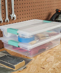 12 Pack Clip Box Stackable Clear Plastic Bins With Latching Lids for Arts and Crafts in workshop setting