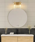 Two Light Brushed Gold Vanity Light With Clear Glass Shades For Bathroom Over Mirror Modern Wall Sconce above round mirror