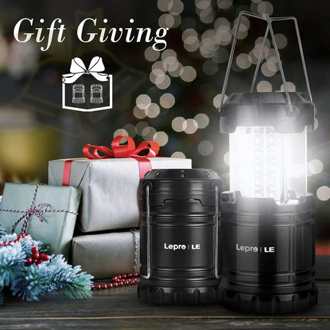 LED Lanterns Battery Powered For Camping And Outdoors, collapsible lanterns next to wrapped gifts, holiday setting