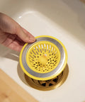 Hand placing Quack Duck Kitchen Sink Strainer Basket Fits All Standard Sinks 4 And A Half Inch Stainless Steel Drain Cover