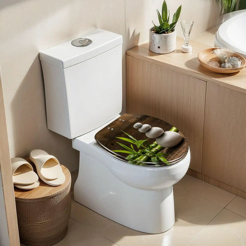 Elongated white zen balance stones bamboo plant on wooden table toilet seat in a modern bathroom setting.