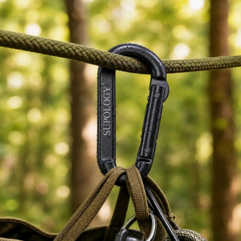 Black D-shaped carabiner attached to rope, labeled SUPOLOGY; part of Heavy Duty Carabiner Clips 900 Lbs Working Load 2.5 Inch set.