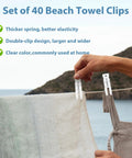 Person using Transparent Balloon Arch Clips 3.5 Inch Heavy Duty Spring Clamps to secure towel on clothesline outdoors.