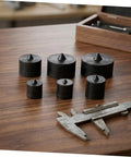 Heavy Duty Metal Shaft Protector Kit With Conical End Guard For Grip O Matic Pullers on wooden surface, showing various sizes.