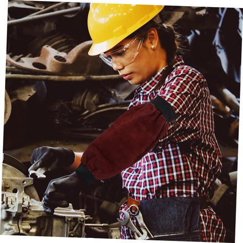 Heavy Duty Welding Arm Sleeves Featuring Flame Resistant Heat Burn Coverage And Flexible Elastic Fit Designed For Mechanics Welders And Tradesmen Demanding Badass Daily Protection on worker in plaid shirt.