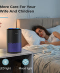 Air Purifier For Bedroom And Office With Sleep Mode And Speed Control, 360 Degree Filtration Cuts Smoke Pollen Dander Hair Odors, Quiet, Easy Setup, MK01 Black next to sleeping woman