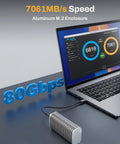 Badass 80Gbps M.2 Nvme Ssd Enclosure with aluminum design, showcasing speed stats connected to a laptop.