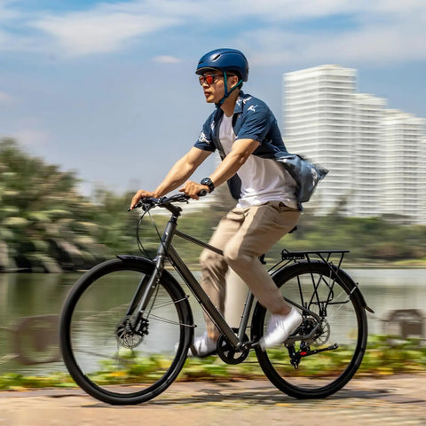 Person riding a bike with Beefy Heavy Duty 700C Bike Tubes Two Pack Fits 700X35C To 700X43C 622 Bead Seat AV32mm Schrader Valve
