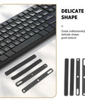 Set Of Four Premium Keyboard Soundproof Foam Space Bar Acoustic Cushion Quiet The Daily Clack For PC Gamers And Streamers Easy Install Silent Dampening Pad next to black keyboard.