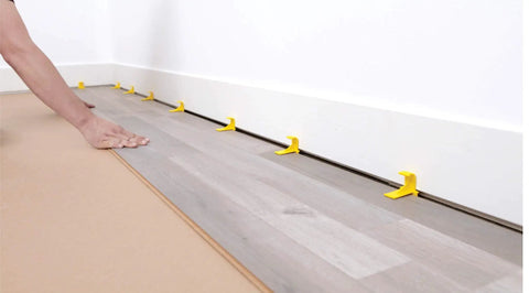 Laminate Flooring Spacers For Easy DIY Floor Installations, T Shape Design Never Falls, Slips, Or Tips, visible placed on floor