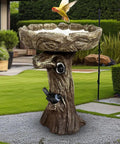 23 Inch Tall Pedestal Bird Bath With Woodland Tree Trunk Decor, Fiber Reinforced Concrete in garden setting