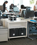 Office setting with desks and Heavy Duty Fireproof Document Box With Handle Portable Waterproof File Organizer for Papers visible.