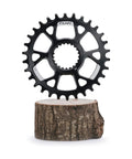 Narrow Wide 30T Direct Mount Chainring For Shimano MTB Cranks, One Piece 7075 Aluminum CNC Finish, displayed on wooden stump.