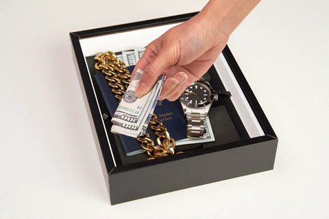 Open Photo Frame Diversion Safe With Hidden Compartment 4x6 Black Mini Safe Box showing cash, jewelry, and a watch inside.