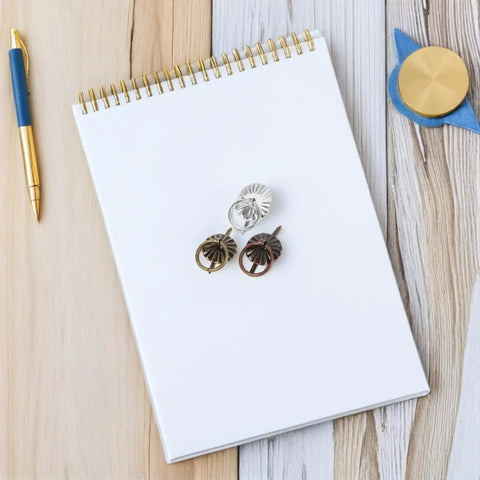 60Pcs Vintage Mini Pull Handles Set Metal Round Drawer Pulls For Cabinets Dressers Cupboards Retro Small Furniture Hardware Accessories With Dope Retro Vibes For Easy DIY Upgrades displayed with a pen on a notebook
