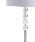 Close-up of Lit Glam Chrome And Crystal LED Floor Lamp With White Linen Drum Shade showing crystal neck accents and part of the shade