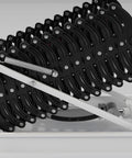 Heavy Duty Electric Attic Ladder With Remote Control, 13 Step Folding Loft Stairs, close-up of black folding mechanism and spring.