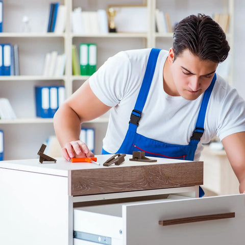 Man installing Premium Plastic Drawer Slide And Guide Replacement Kit With All Necessary Screws for furniture repair.