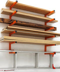 Heavy Duty Wall Mounted Lumber Rack Go Big Or Go Home Holds Over A Ton Knock Clutter Outta The Way Super Metal Wood Organizer Shelf For Garage Workshop 4 Pack Orange with lumber and tools organized.