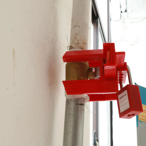Adjustable Ball Valve Lockout Device For Half To Two And A Half Inch Valves installed on outdoor pipeline with padlock compatibility
