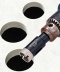 Front-right view of a 3/4 inch diamond-tipped hole saw bit with pilot bit mounted in a drill chuck