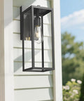 Dusk To Dawn Sensor Outdoor Wall Lantern 15 Inch Tall Anti Rust Black Exterior Light on a white siding wall