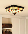 Finley Two Light Valiant Bronze Flush Mount with Multicolored Tiffany Glass Shade installed in a ceiling, showing its design.