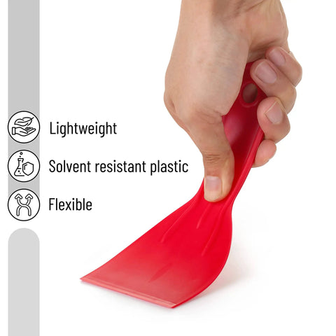 Hand holding a red flexible scraper from the Six Pack Plastic Putty Knife Set With 1.5 To 6 Inch Flexible Solvent Resistant Scrapers