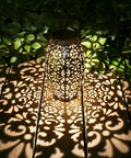 Two Pack Solar Lantern Lights For Hanging Or Table Outdoor Patio Garden Silver Finish casting patterned glow on wooden deck