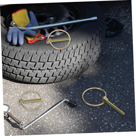 Heavy Duty Lynch Pin Kit 12 Piece Assortment For Trailers Tractors Trucks Lawn Mowers Lock Clips Easy Installation Reliable Beefy Steel Pins For Quick Release And Secure Fit In Hauling Towing, 3/16 in pins beside trailer tire