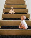 Non Slip Carpet Stair Treads For Wooden Stairs Indoor Stick On Runners 14 Pcs 8x30 Inches No Slip Grip For Dogs Kids And Seniors Black Easy To Install. Image shows a baby and a puppy on wooden stairs with black non-slip treads.