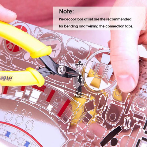 Pro Grade Metal Earth Model Kit Tools Set 2 Piece Clipper And Needle Nose Pliers For Metal Puzzles in use on metal sheet