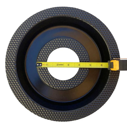 Top view of Donut Sprinkler Head Mold For Concrete And Garden Decor Reusable Plastic Form with measuring tape across 8 inch hole.