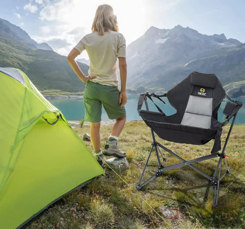 Hammock Camping Chair Set Outdoor Folding Rocker Lawn Seats With High Back And Stand by a tent at a lake