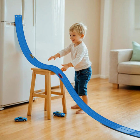 Child playing with Race Car Track Starter Set With Flexible 15 Foot Ramp, Portable Ramp Track System in living room.