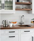 Modern kitchen with 6 Pack Matte Black Stainless Steel Kitchen Cabinet Door Handles on white cabinets and wood countertop